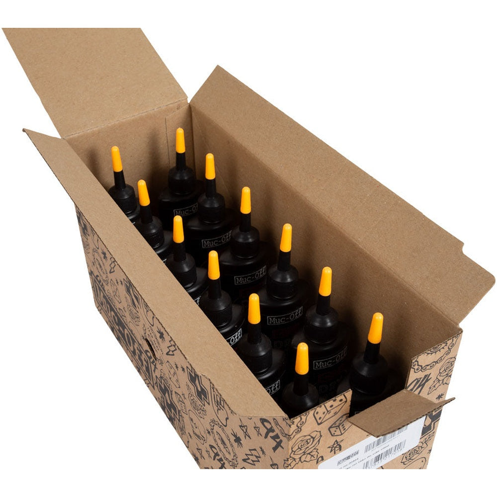 Box of 12 Muc-Off Bio Dry Chain Lube 120ml bottles with yellow nozzle caps