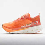 On Cloudboom Strike women's running shoe in orange sunstone colorway with white sole