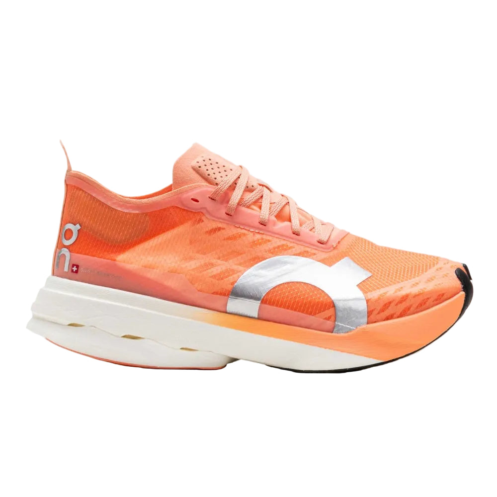 On Cloudboom Strike running shoe in coral orange and white colorway
