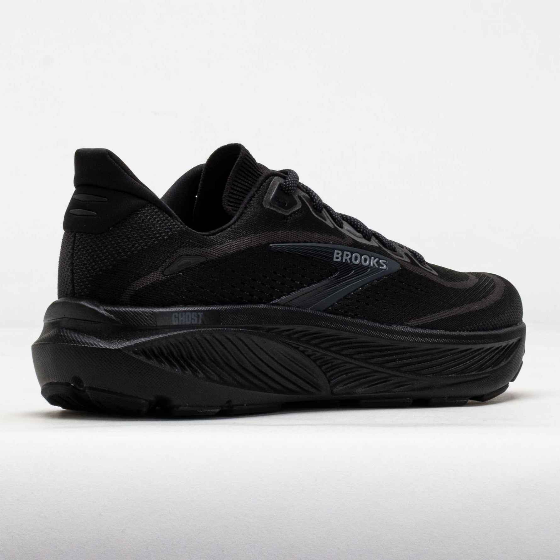 Brooks Ghost running shoe in all black colorway on white background