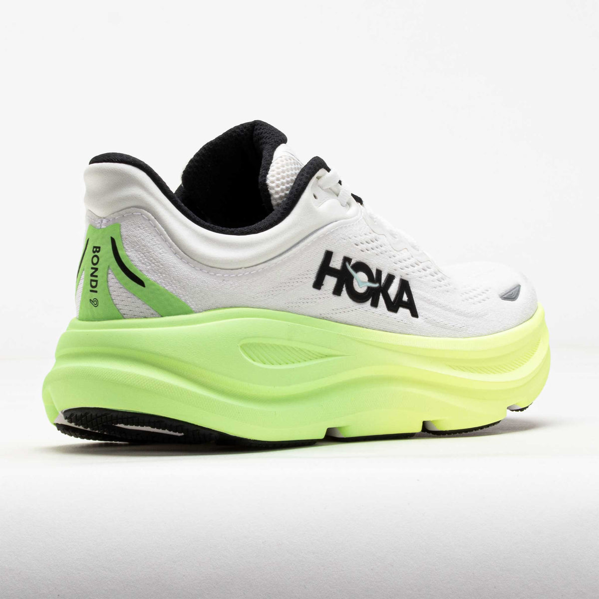 HOKA Bondi 9 running shoe in white and tart apple green, rear three-quarter view
