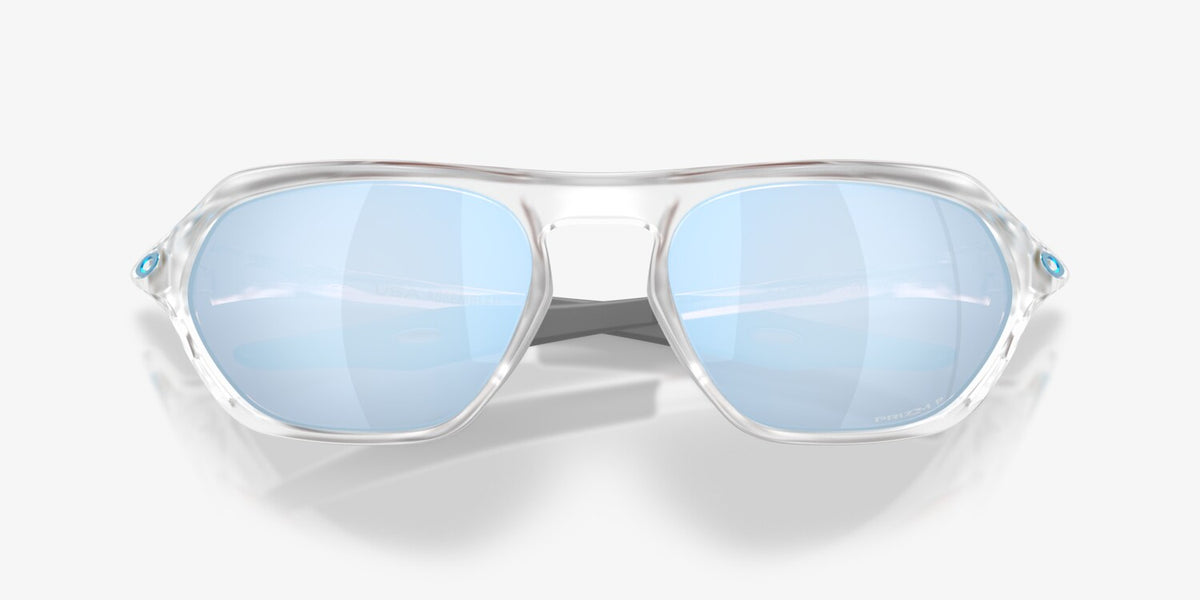 Oakley Cage Jacket sunglasses front view with clear frame and blue Prizm Deep Water polarized lenses