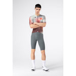 Male model wearing Gobik Attitude 2.0 short sleeve jersey in Flank colorway, arms crossed, full body view