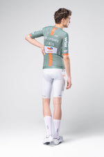 Gobik Raeactive Men Jersey Ineos Netcompany in sage green with orange stripes, rear view on male model