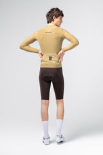Gobik Avalon Long Sleeve Jersey in Keemun color, rear view showing back pockets on male model