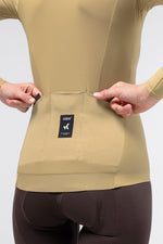 Close-up of Gobik Avalon jersey back pocket detail with Gobik branding in Keemun color
