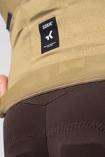 Detailed close-up of Gobik Avalon jersey hem and Gobik Non-Conformist label in Keemun colorway