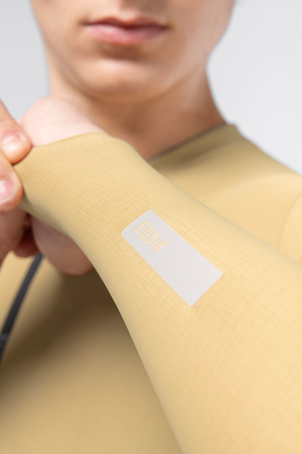 Close-up of Gobik Avalon jersey sleeve cuff with reflective Gobik logo on male model