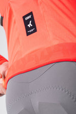 Gobik Avalon jersey back detail showing brand label and ripstop fabric panel in lava color
