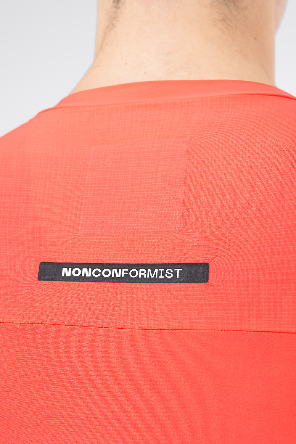 Close-up of Gobik jersey back showing Nonconformist label and ripstop fabric panel detail