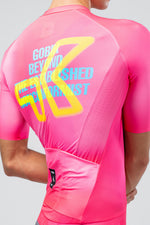 Gobik CX Pro cycling jersey back view in neon pink Drip colorway with bold graphic text