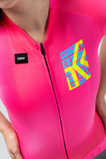 Gobik CX Pro 4.0 women's cycling jersey in neon pink Drip colorway with graphic chest print