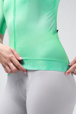 Gobik CX Pro 4.0 cycling jersey in Blast mint green showing hem detail with model