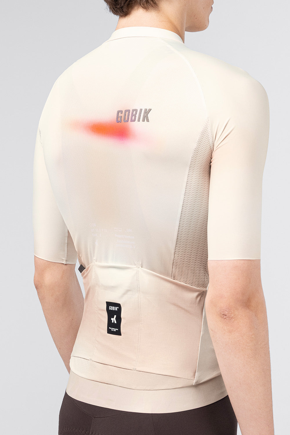Gobik CX Pro 4.0 cycling jersey back view showing textured side panels and rear pockets