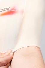Close-up of Gobik CX Pro 4.0 sleeve hem detail showing fabric texture and silicone gripper in almond