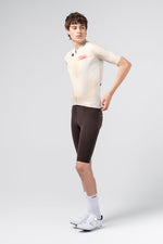 Gobik CX Pro 4.0 men's jersey in almond colorway, three-quarter side view on male model