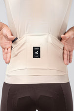 Back pocket detail of Gobik CX Pro 4.0 jersey in almond showing Gobik brand label and storage pockets