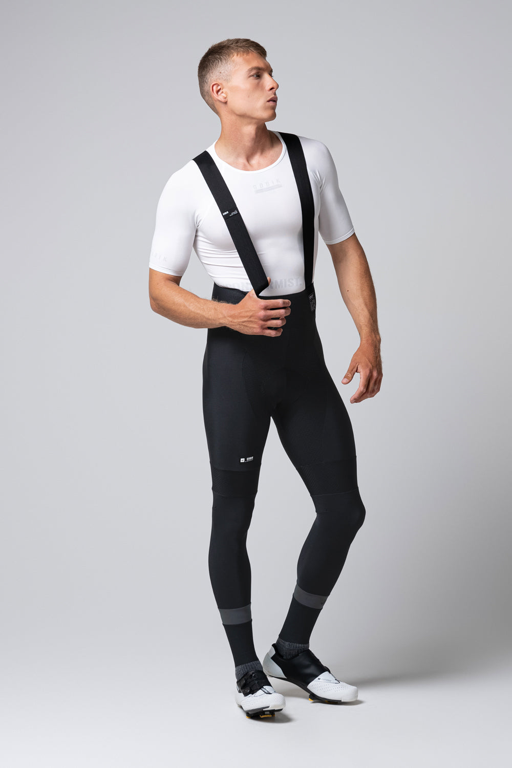 Male cyclist wearing black Gobik Absolute 7.0 bib shorts with white jersey