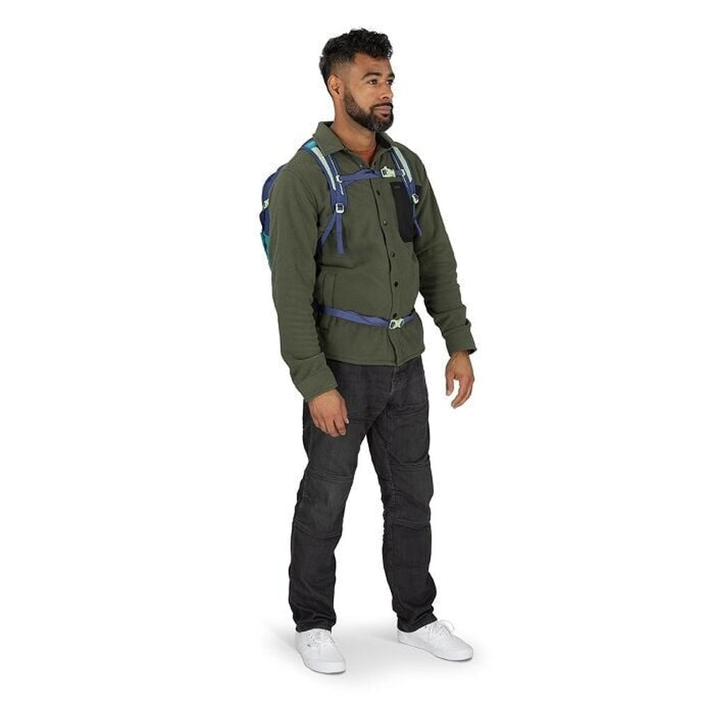Man wearing Osprey Daylite Plus backpack in Night Shift teal and navy colorway, front view