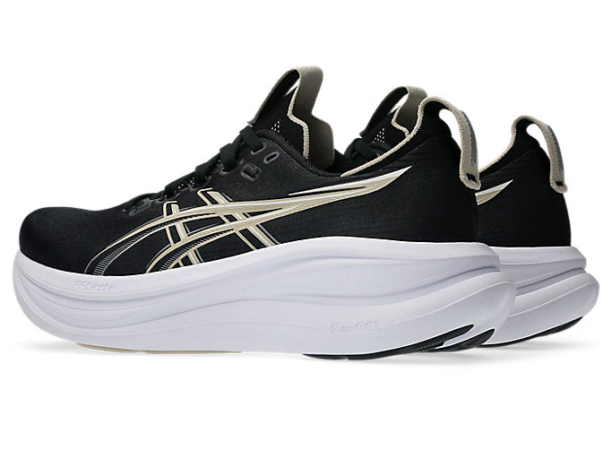 ASICS Gel Nimbus 28 running shoes in black with gold stripes and white sole