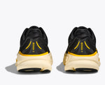 Rear view of black Hoka Bondi 9 running shoes with yellow accents and cream midsole