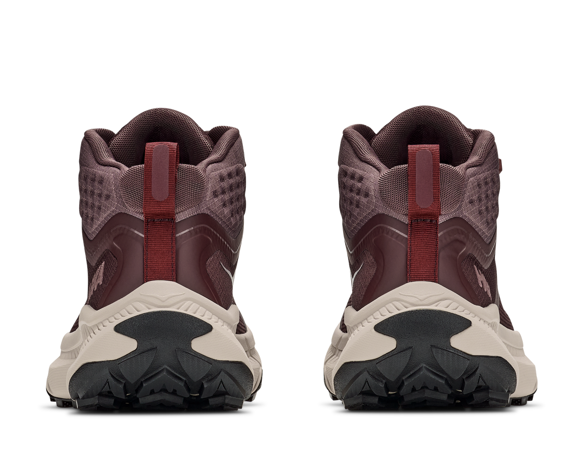 Rear view of pair of Hoka Transport Hike GTX boots in deep mauve showing heel pull tabs