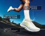 HOKA Clifton 11 running shoe in white with green accents worn by runner mid-stride