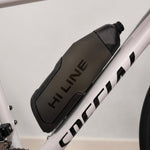 Hi Line Slipstream aero bottle cage mounted on white Cipollini road bike frame close-up