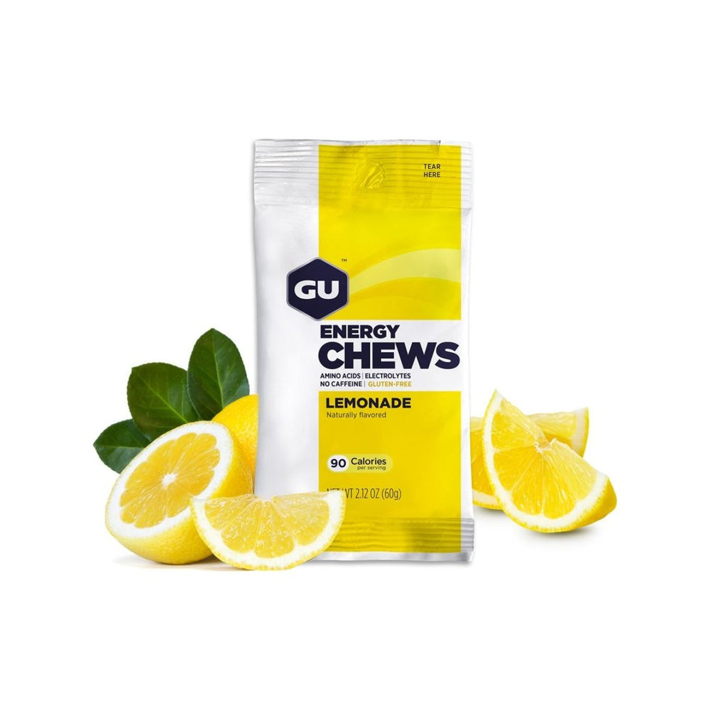 GU Energy Chews Lemonade flavor 60g packet surrounded by fresh lemons