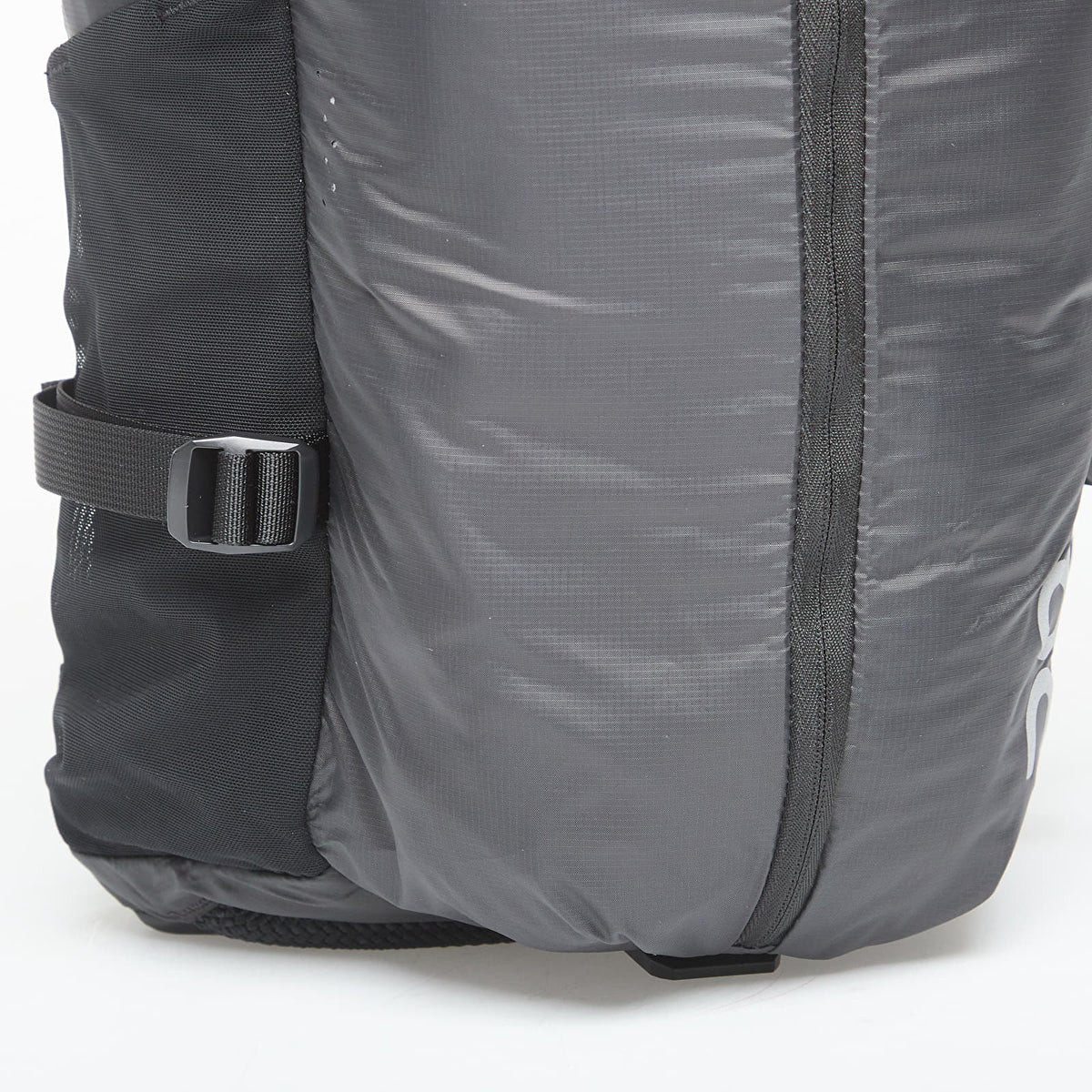 On Speed Pack 18L Lite backpack in Magnet gray with black compression straps and buckle