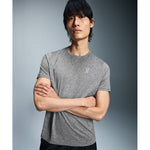 Man wearing On Core Long-T heather grey t-shirt with arms crossed