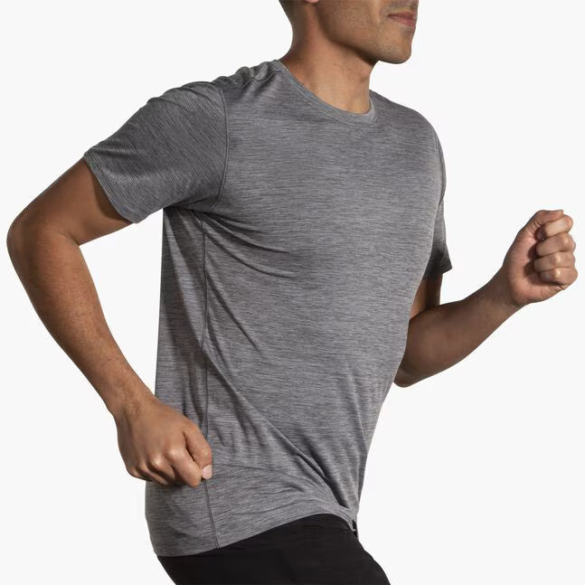 Man running in Brooks Luxe Short Sleeve heather charcoal gray performance tee