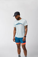 Man wearing Brooks Distance Short Sleeve 3.0 in HTR Ash with mountain graphic print