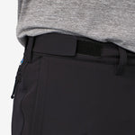 Close-up of black Patagonia trail pants waistband with velcro patch detail