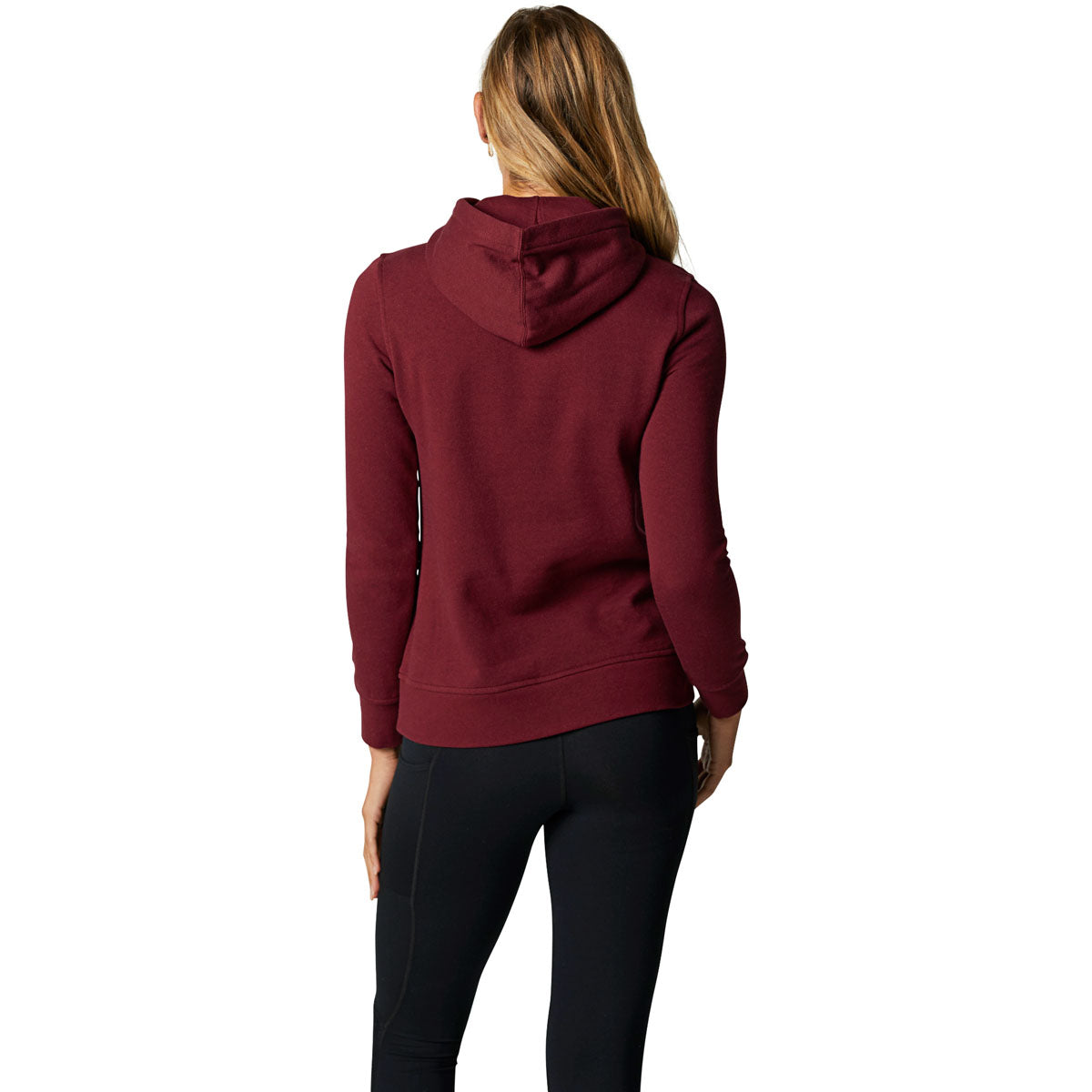 Back view of woman wearing cranberry Fox Racing pullover hoodie with black pants