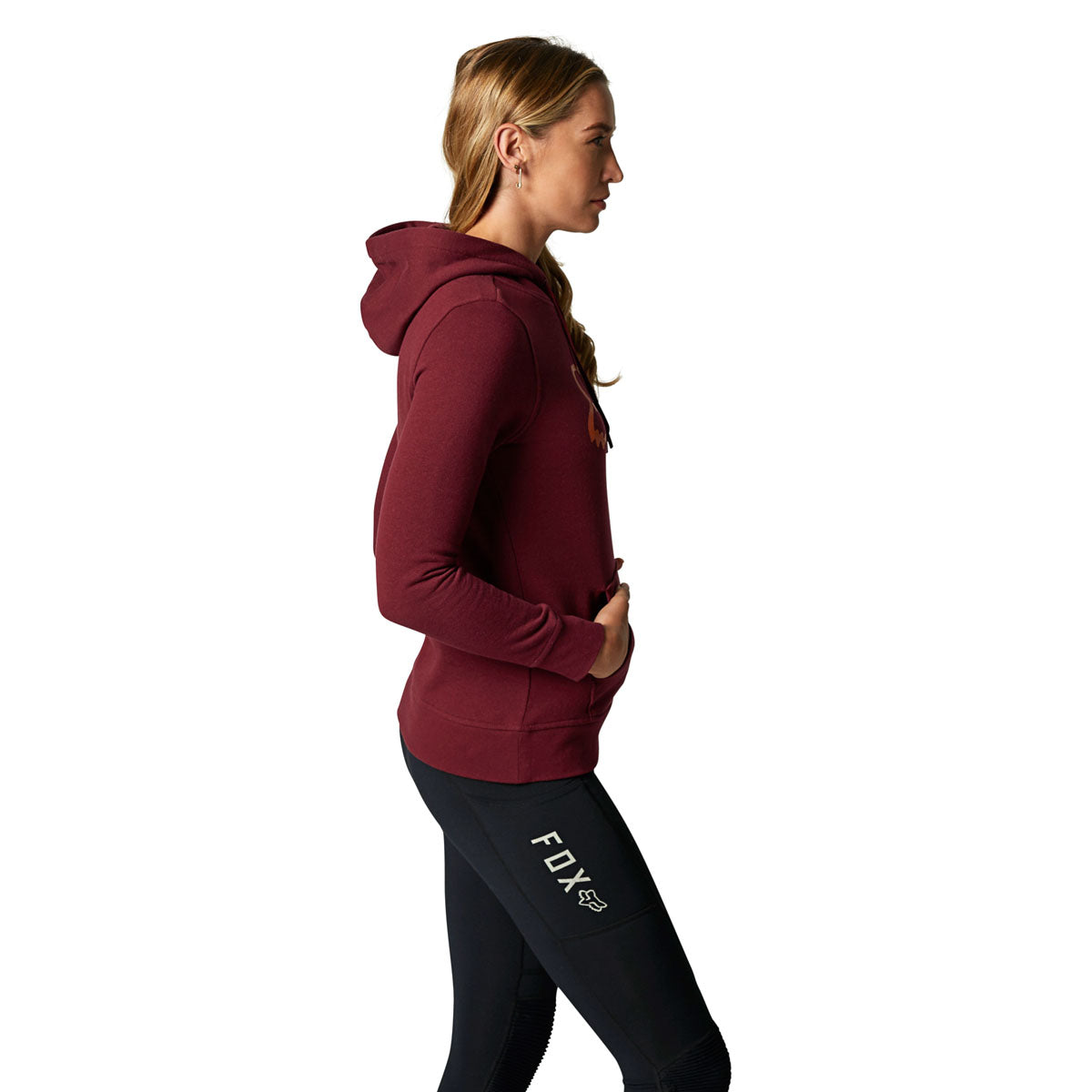 Woman wearing Fox Racing burgundy pullover fleece hoodie with kangaroo pocket