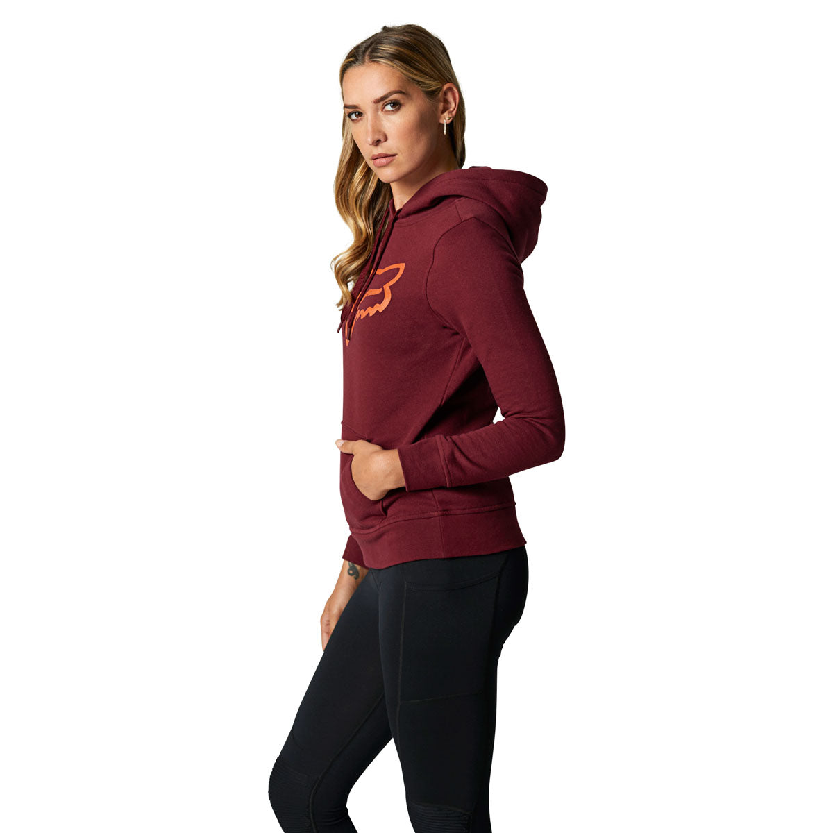 Woman wearing Fox Racing cranberry pullover fleece hoodie with orange logo