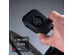 Hand holding Ravemen FR1100 bike light showing power button and battery level indicator legend
