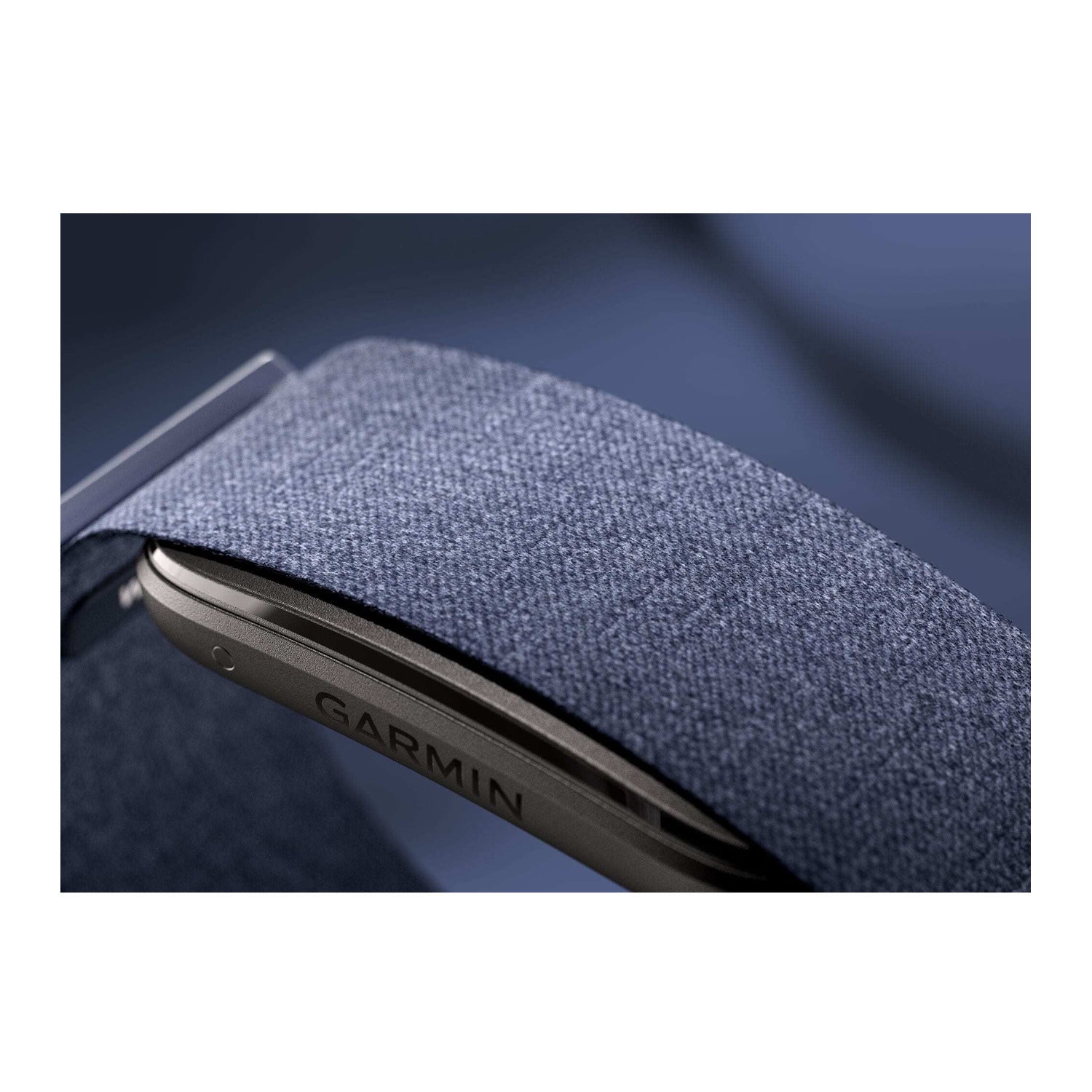 Garmin CIRQA smart band close-up showing Captain Blue fabric strap and dark housing