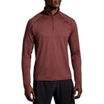 Brooks Dash half-zip pullover in heathered burgundy worn by male model