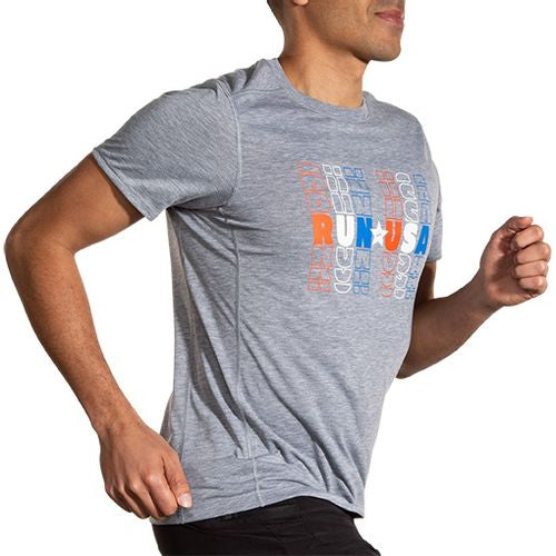 Man running wearing Brooks Distance Short Sleeve 2.0 in HTR Ash Run USA colorway