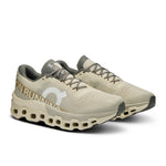 On Cloudmonster 2 running shoes in cream and sage green colorway