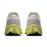 On Cloudmonster 3 running shoes rear view showing ivory upper, limelight Helion midsole pair