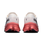 On Cloudmonster 3 running shoes rear view showing ivory upper and dustrose heel and midsole