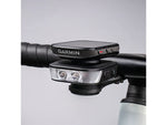 Ravemen FR1100 front light mounted on handlebar with Garmin Edge GPS unit stacked on top