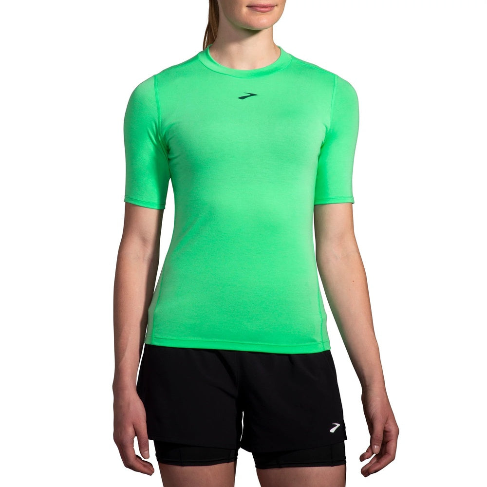Brooks High Point Short Sleeve in Hyper Green worn by female model on white background
