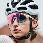 KOO cycling sunglasses with white frame and photochromic lenses on female cyclist