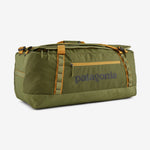Patagonia Black Hole Duffel 70L in olive green with orange straps and zippers