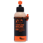 Orange Seal 4oz Tubeless Sealant with injection system, black bottle and orange branding