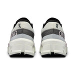 On Cloudmonster 2 running shoes in undyed white with gray heel detail, rear view